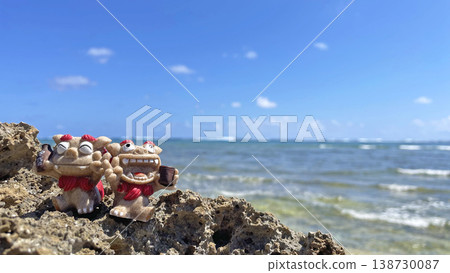 Okinawa's blue sea and a Shisa holding a bottle of Awamori (Okinawan liquor) - Landscape photograph (copy space available) Okinawa's blue sea and a Shisa holding a bottle of Awamori (Okinawan liquor) - Landscape photograph (copy space available) 138730087