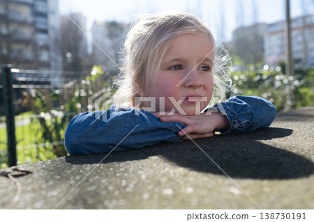 Close up portrait of a lovely 4 year old girl walking outdoors Close up portrait of a lovely 4 year old girl walking outdoors 138730191