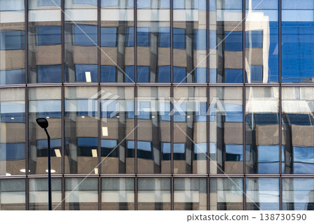 Urban reflections on large building on London street Urban reflections on large building on London street 138730590