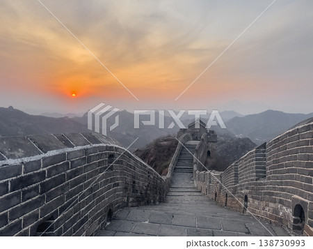 Sunset glows over ancient stone walls 138730993