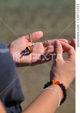 close-up of a pendulum in your hand 138731031