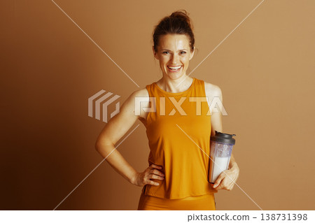 Cheerful Woman with Protein Shake and Activewear Cheerful Woman with Protein Shake and Activewear 138731398