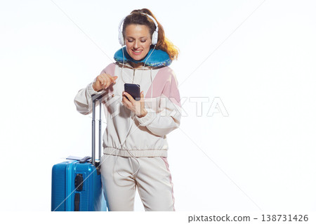 Woman Pointing at Smartphone Screen while Traveling Woman Pointing at Smartphone Screen while Traveling 138731426