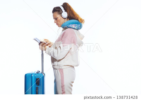Traveler Checking Documents with Teal Suitcase 138731428