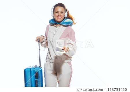 Happy Woman Traveler Holding Ticket and Suitcase Happy Woman Traveler Holding Ticket and Suitcase 138731430
