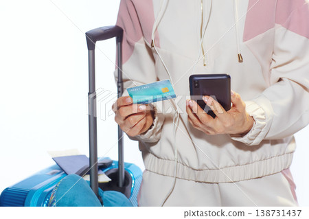 Woman Managing Travel Finances with Mobile Banking Woman Managing Travel Finances with Mobile Banking 138731437