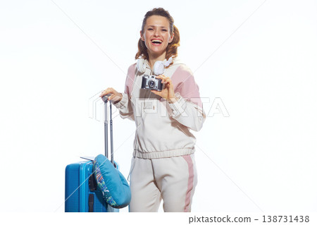 Happy Solo Traveler with Camera and Blue Suitcase 138731438