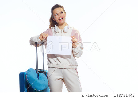 Excited Woman Traveler Looking Up with Blank Sign 138731442