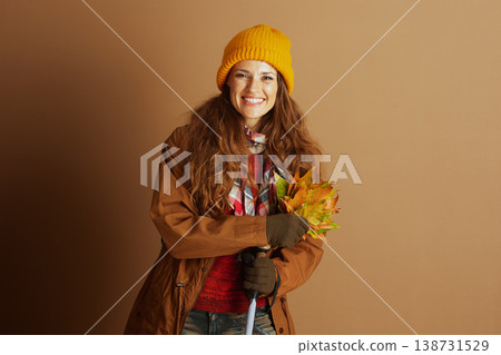 Happy Hiker with Autumn Leaves and Walking Stick 138731529