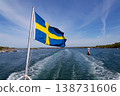 Swedish flag on ferry near bridge between Styrso and Donso islands of Gothenburg archipelago, Gothenburg Minucipality, Vastra Gotaland County, Sweden, sunny day 138731606