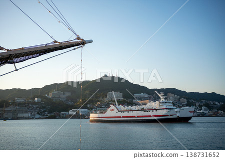 Port town scenery: large ships and houses nestled in the mountains Port town scenery: large ships and houses nestled in the mountains 138731652