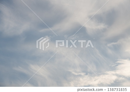 Cirrus clouds creating delicate patterns in blue sky Cirrus clouds creating delicate patterns in blue sky 138731835