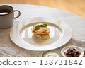 Delicious pancakes with mint leaves, jam and cream for breakfast 138731842