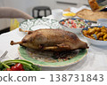 Roasted goose lying on a plate, celebrating christmas with family 138731843