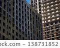 Construction workers building new apartment buildings in a developing urban area 138731852