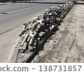 Paving stones piled along curb during road construction 138731857
