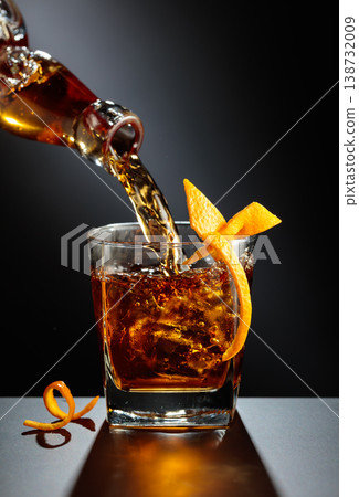 Old fashioned cocktail on a black table. Old fashioned cocktail on a black table. 138732009