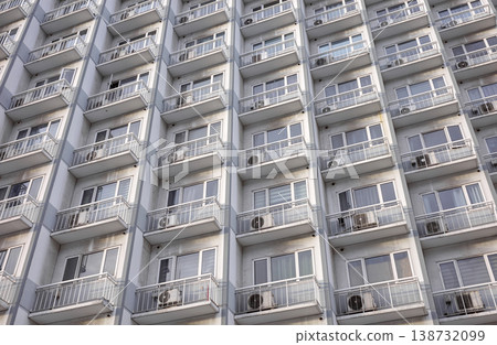 The facade of a residential building with balconies. The facade of a residential building with balconies. 138732099