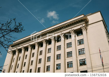 Large neoclassical government building with tall columns and Serbian flag in Belgrade. Concept of authority, stability and institutional architecture 138732816
