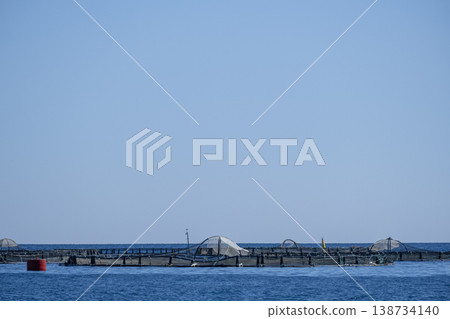 Offshore Fish Farm in the Open Sea. Sustainable Fish Farming in the Middle of the Sea. Offshore Fish Farm in the Open Sea. Sustainable Fish Farming in the Middle of the Sea. 138734140