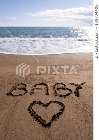 Baby writ on a sand. Baby written in the sand on the beach. Baby writ on a sand. Baby written in the sand on the beach. 138734408
