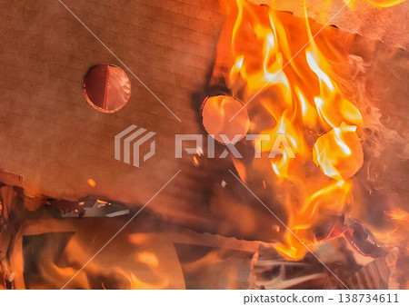 Burning cardboard boxes red-orange flame, paper waste, recycling closeup Burning cardboard boxes red-orange flame, paper waste, recycling closeup 138734611
