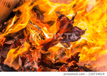Burning cardboard boxes red-orange flame, paper waste, recycling closeup 138734629