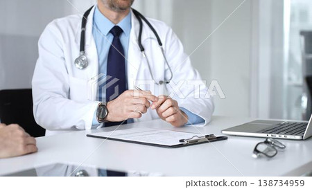 Doctor man discussing diagnosis with woman patient during medical consultation in clinic, offering healthcare advice for treatment. Medicine, health care and science concept Doctor man discussing diagnosis with woman patient during medical consultation in clinic, offering healthcare advice for treatment. Medicine, health care and science concept 138734959