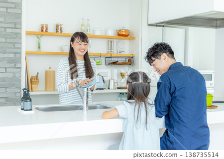 A parent and child talking in the kitchen A parent and child talking in the kitchen 138735514
