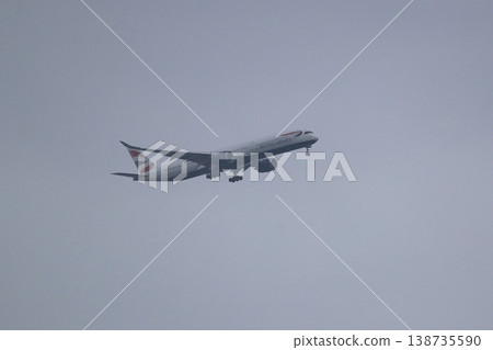 A passenger plane in landing approach (overcast sky) - Image 138735590