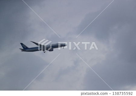A passenger plane in landing approach (overcast sky) - Image 138735592