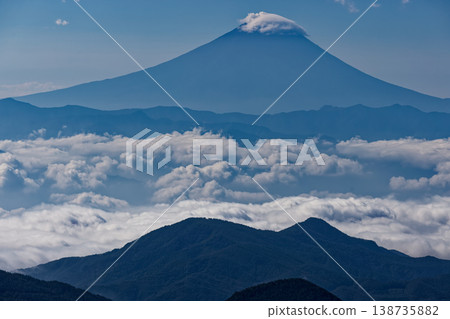 Mount Fuji above the clouds as seen from Mt. Asahi in Okuchichibu Mount Fuji above the clouds as seen from Mt. Asahi in Okuchichibu 138735882