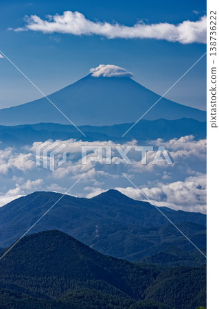 Mount Fuji above the clouds as seen from Mt. Asahi in Okuchichibu Mount Fuji above the clouds as seen from Mt. Asahi in Okuchichibu 138736222