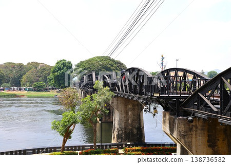 The Bridge over the River Kwai in Kanchanaburi, Thailand, which served as a filming location for the movie. The Bridge over the River Kwai in Kanchanaburi, Thailand, which served as a filming location for the movie. 138736582