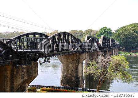The Bridge over the River Kwai in Kanchanaburi, Thailand, which served as a filming location for the movie. The Bridge over the River Kwai in Kanchanaburi, Thailand, which served as a filming location for the movie. 138736583