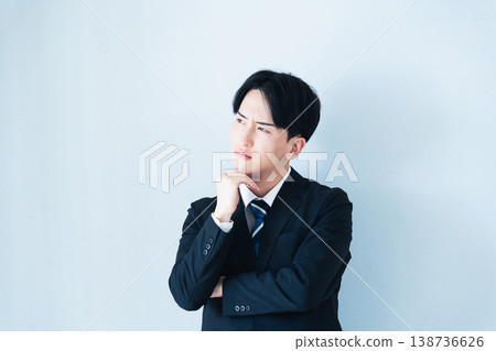 A businessman who thinks with arms A businessman who thinks with arms 138736626
