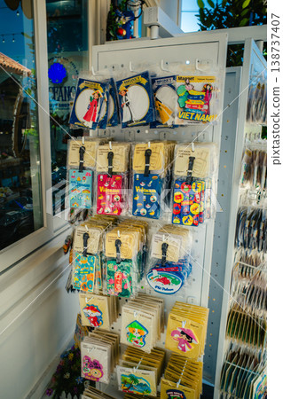 A display shelf of souvenirs and luggage tags from a trip to Vietnam. 138737407