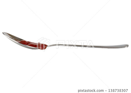 A spoon and ketchup. isolated on white background A spoon and ketchup. isolated on white background 138738307