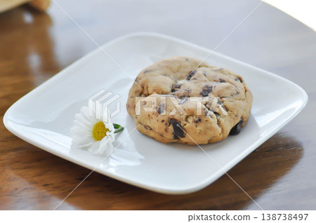 cookie, cooky or chocolate chip cookie or chocolate cookie or soft cookie 138738497