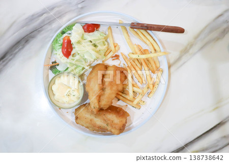 fish and chips or fried fish with French friesand salad fish and chips or fried fish with French friesand salad 138738642
