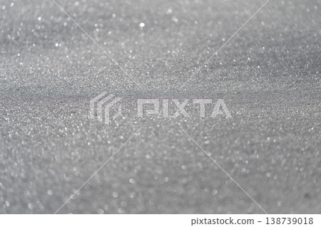 Sparkling icy landscape. Brightly illuminated snow and ice with dazzling light effects. Glistening snowladen ground displaying complex reflections and sparkling frost details 138739018