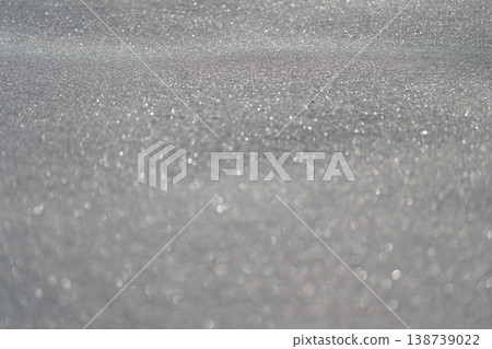 Serene winter white surface featuring gentle bokeh effects and textures. Minimalistic winterthemed background with soft highlights and smooth granular texture for digital branding Serene winter white surface featuring gentle bokeh effects and textures. Minimalistic winterthemed background with soft highlights and smooth granular texture for digital branding 138739022