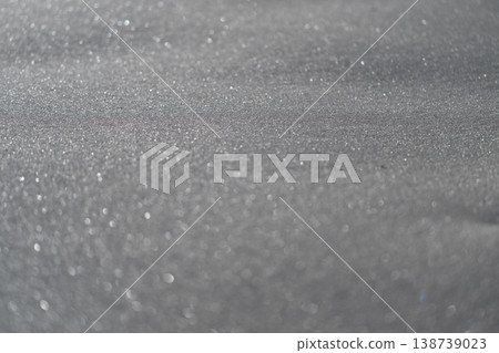 Icy reflective surface. Closeup of crystal clear ice with shimmering ridges and frost designs. Macro shot capturing intricate frost formations and luminous edges on icy surface Icy reflective surface. Closeup of crystal clear ice with shimmering ridges and frost designs. Macro shot capturing intricate frost formations and luminous edges on icy surface 138739023