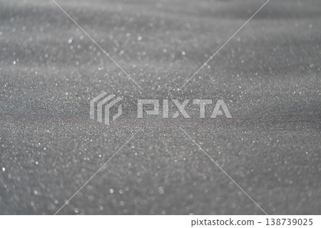 Silent snowcovered terrain exhibiting soft illumination and gentle shading effects. Quiet winter landscape characterized by powdery snow and delicate shadow play 138739025