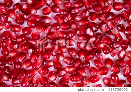 Red seed pattern. Macro image showcasing repetitive glossy pomegranate seed formations. Detailed close examination of bright red pomegranate seeds in artistic pattern Red seed pattern. Macro image showcasing repetitive glossy pomegranate seed formations. Detailed close examination of bright red pomegranate seeds in artistic pattern 138739092