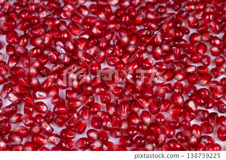 Lustrous arils serve as natural extract inspiration in skincare design. Vibrant pomegranate seeds act as source for luxurious and innovative cosmetic formulations 138739225