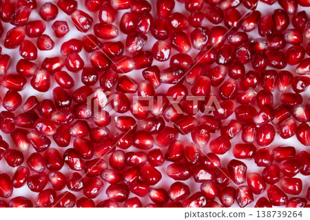 Freshly prepared garnished pomegranate seeds look appealing. Vivid red juicecoated pomegranate seeds artistically arranged to evoke freshness and culinary appeal Freshly prepared garnished pomegranate seeds look appealing. Vivid red juicecoated pomegranate seeds artistically arranged to evoke freshness and culinary appeal 138739264