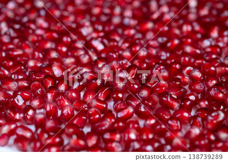 Pomegranate seeds as natural beauty pigment, vivid macro detail of antioxidantrich arils, spa and cosmetic product inspiration, sustainable cosmetic concept with glossy texture 138739289