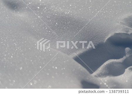 Silent snowy scenery. Peaceful winter with soft snow. Tranquil icy fields with gentle snow patterns. Calm winter landscapes showcasing smooth and serene snow formations 138739311