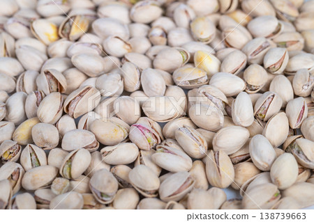 Closeup image of sophisticated pistachio treat. Highquality closeup showcasing luxurious pistachios with smooth shells and vibrant green centers for culinary crafts 138739663